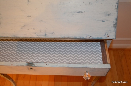 Chevron patterned paper lines the drawers
